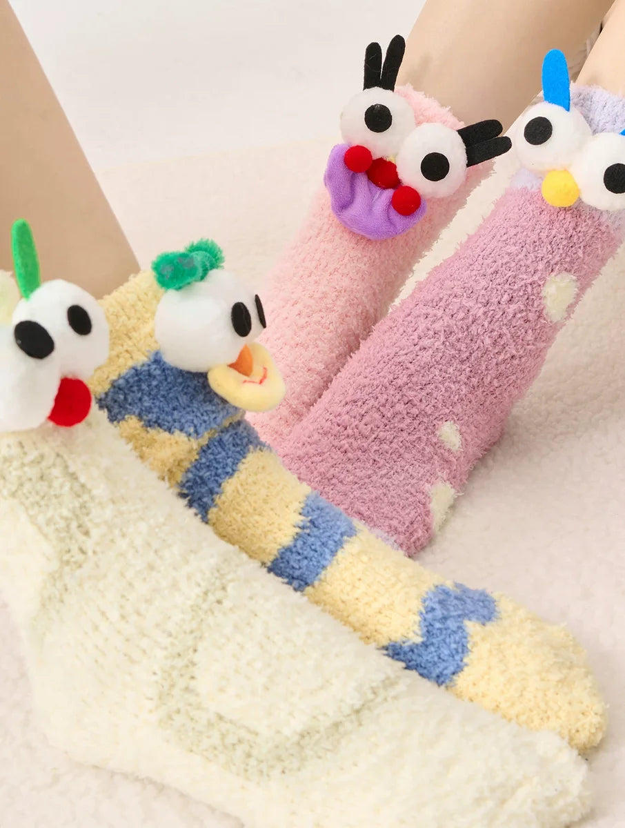 Four Happy Lemon character socks worn together