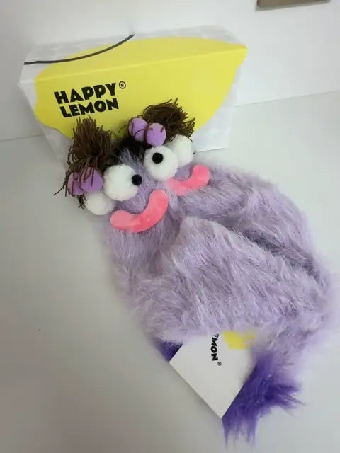 The Daydreamer sock lying on its Happy Lemon gift box